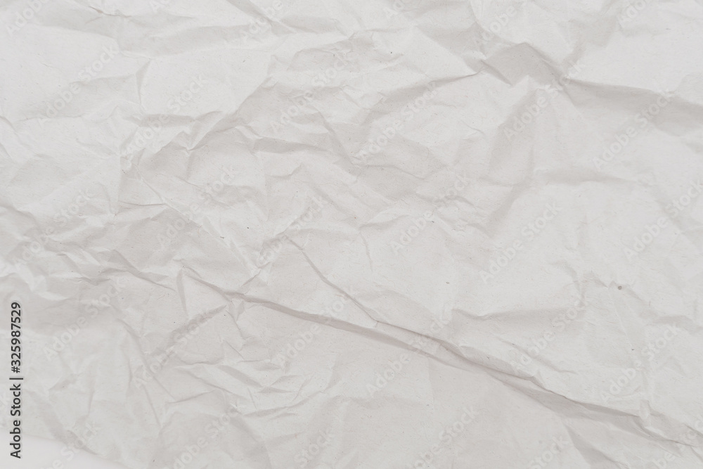 Obraz premium White crumpled paper texture background. Close-up.