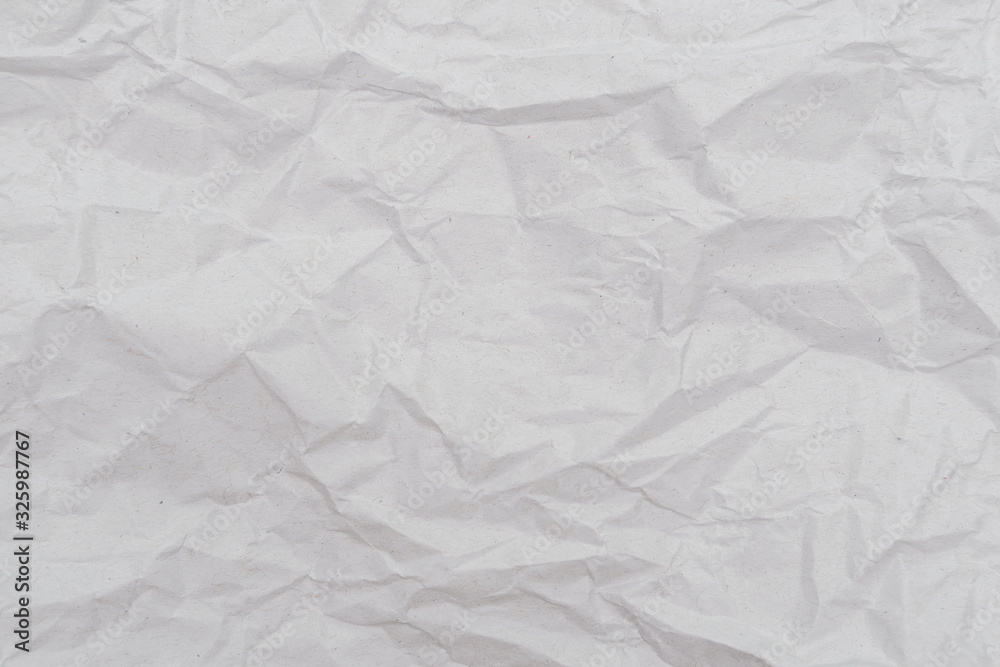 White crumpled paper texture background. Close-up. White crumpled paper texture background. Close-up.