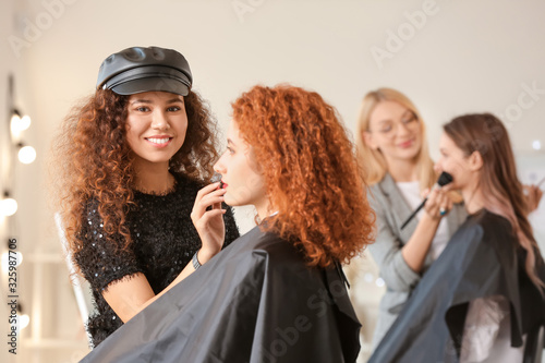 Young woman with model in m...
