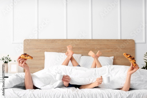 Young couple having breakfa...
