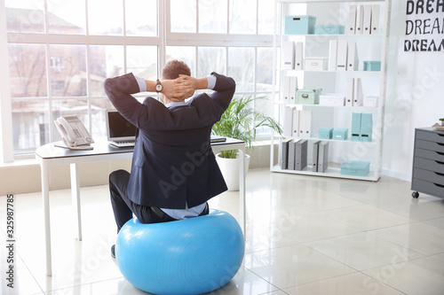 Businessman sitting on fitn...