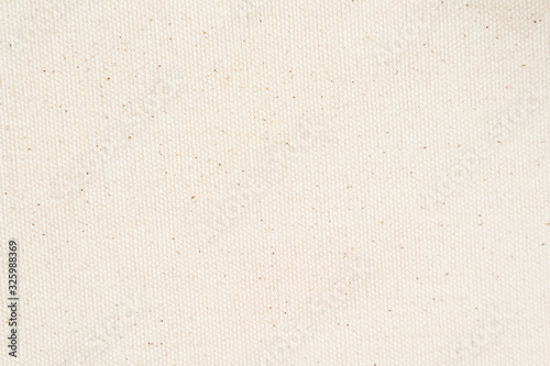 White canvas texture background. Close-up.