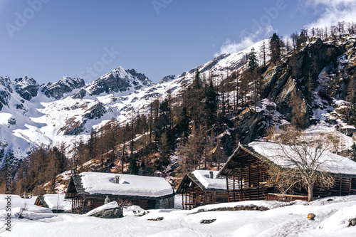 The traditional architecture of the Walser villages in the valleys of Monte Rosa, during a fantastic winter day, near the town of Alagna, Italy - February 2020. © Roberto