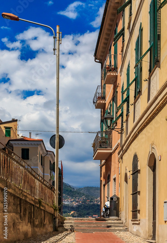 Colorful old buildings of a hilltop medieval town of Ventimiglia in Italy across from the French border