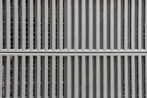 Grey metal surface with a two-part grid  background