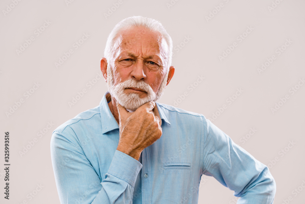 Portrait of authoritative and serious senior man. Portrait of authoritative and serious senior man.