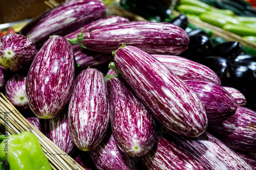 Striped purple eggplant in market