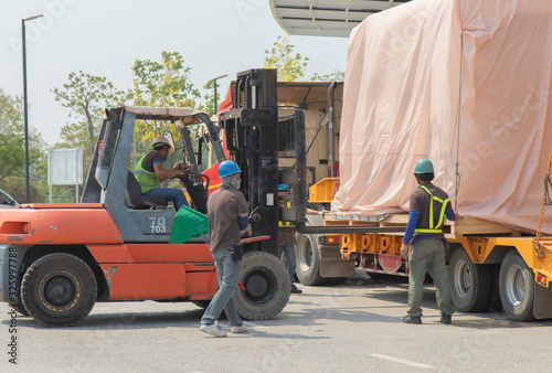 forklift is lifting train head