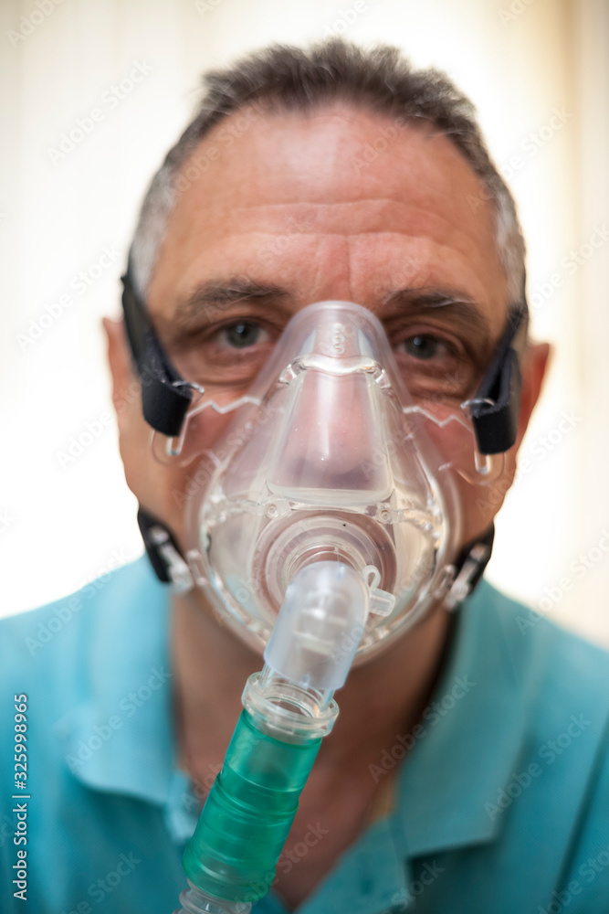 older man with oxygen mask older man with oxygen mask