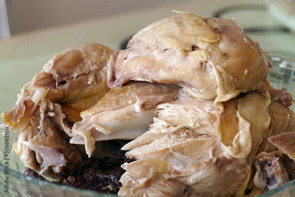 a boiled whole chicken, chicken boiled in water, a boiled whole chicken, chicken boiled in water,