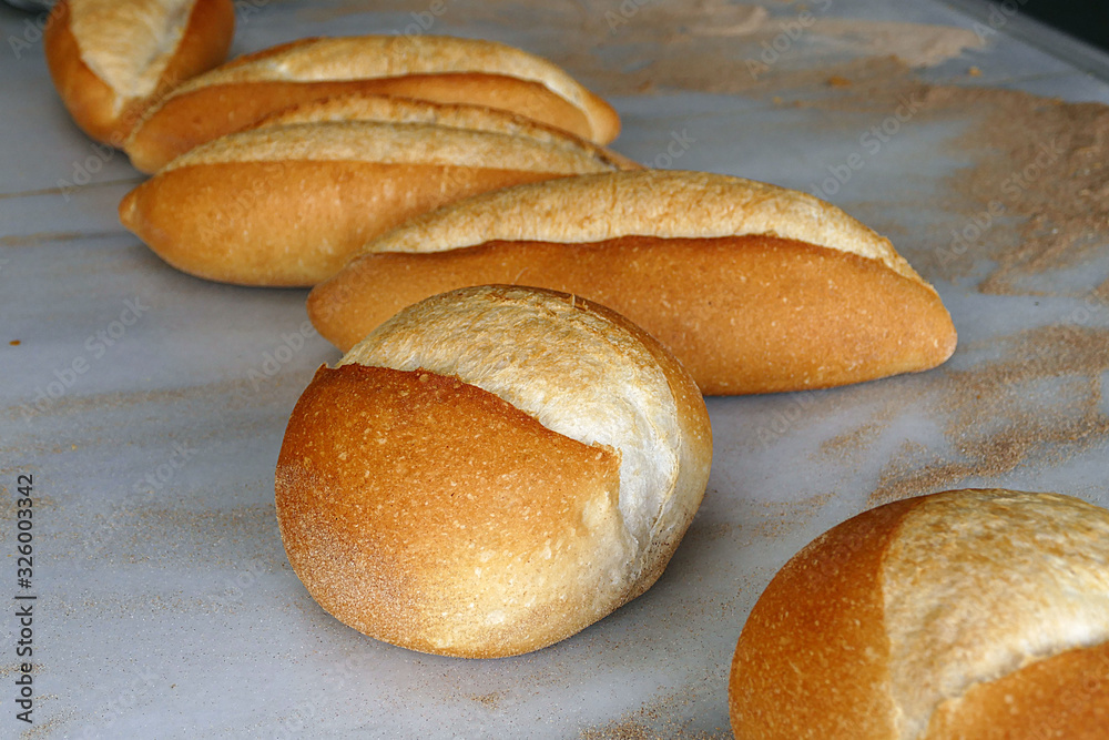 a large amount of freshly baked bread in the bakery,