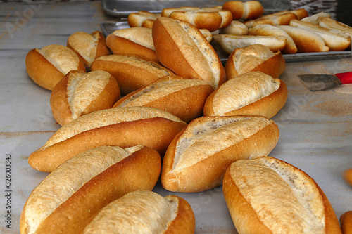 a large amount of freshly baked bread in the bakery,