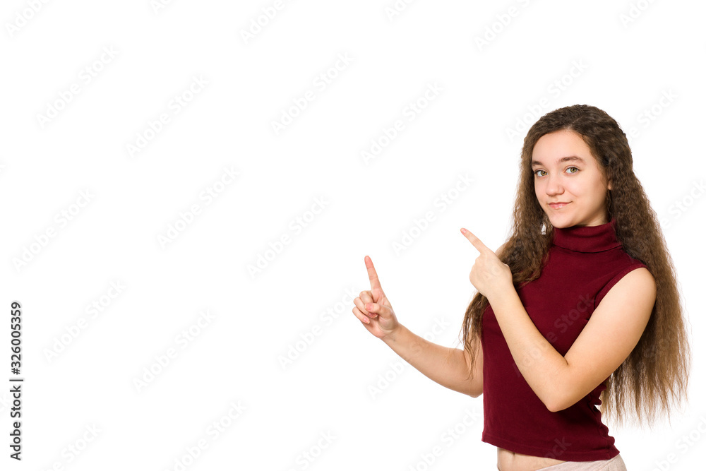 Cute young teenager holding hand showing ads, isolated over a white background Cute young teenager holding hand showing ads, isolated over a white background