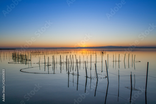 jetty of saler lake at sunset, in the lagoon