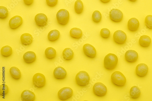 The concept of minimalism. background of delicious bright yellow sweets on a bright yellow background. top view.