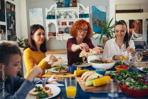 family gathering at home. vegan dinner party