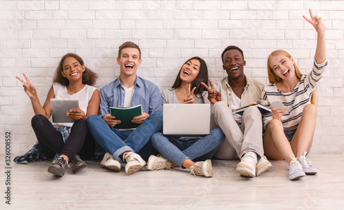 Group of happy students studying for university exams photo