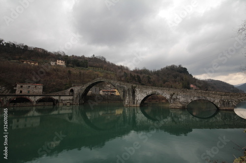 Ponte della Maddalena - Ponte del Diavolo - Devil's Bridge in Borgo a Mozzano, Lucca, Tuscany, Italy photo