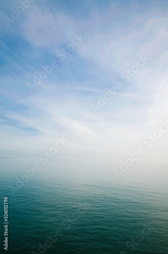 Scenic view of sky and sea blending into a misty white horizon