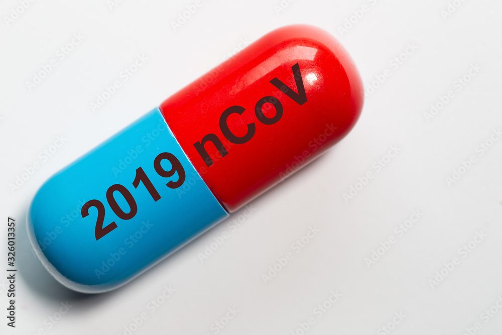 symbolic photo of a pill in blue red with the technical term for the corona virus 2019 nCoV symbolic photo of a pill in blue red with the technical term for the corona virus 2019 nCoV