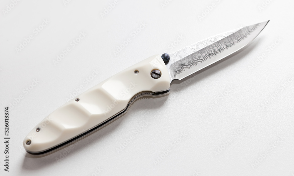 Folding Knife on a white background Folding Knife on a white background