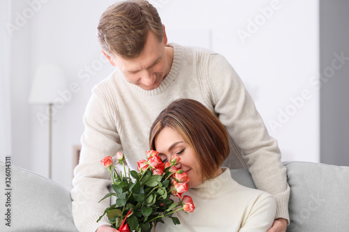Happy husband giving his wi...