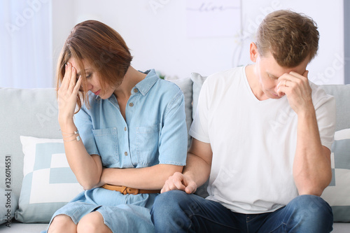 Sad couple after quarrel at...