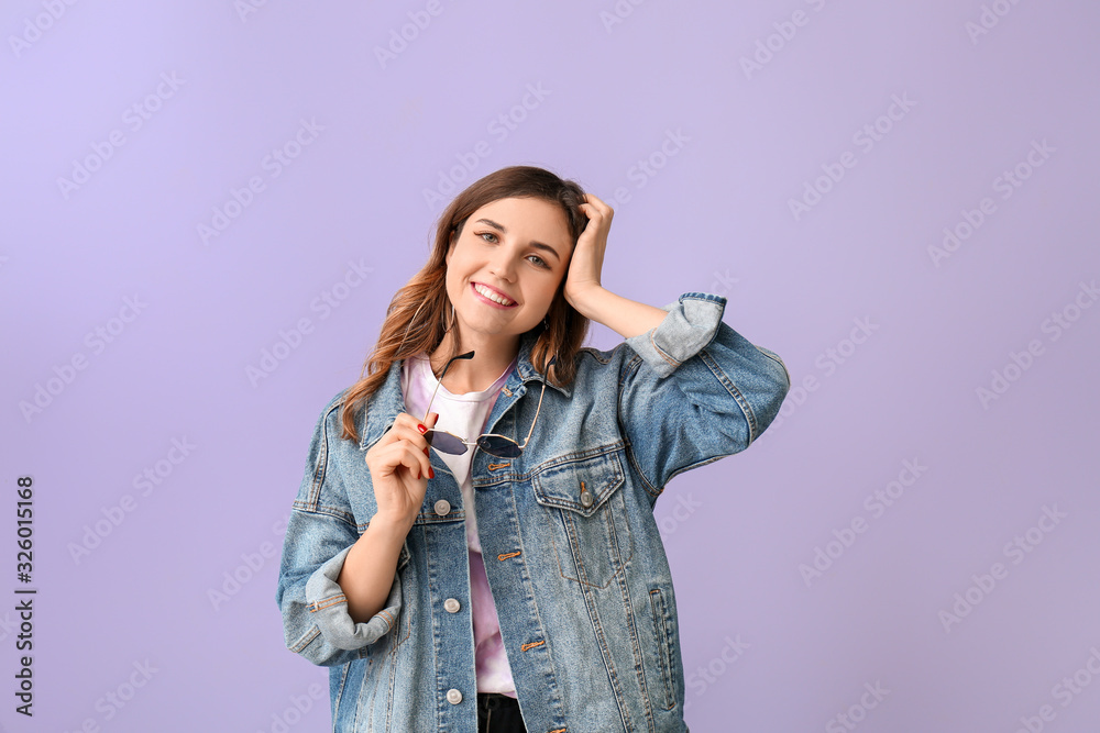 Young woman with stylish sunglasses on color background Young woman with stylish sunglasses on color background