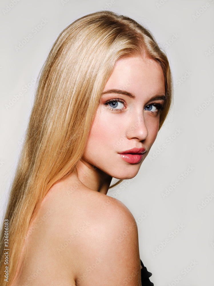 Portrait of beautiful blonde young woman face. Spa model girl with fresh clean skin isolated on a white background Portrait of beautiful blonde young woman face. Spa model girl with fresh clean skin isolated on a white background