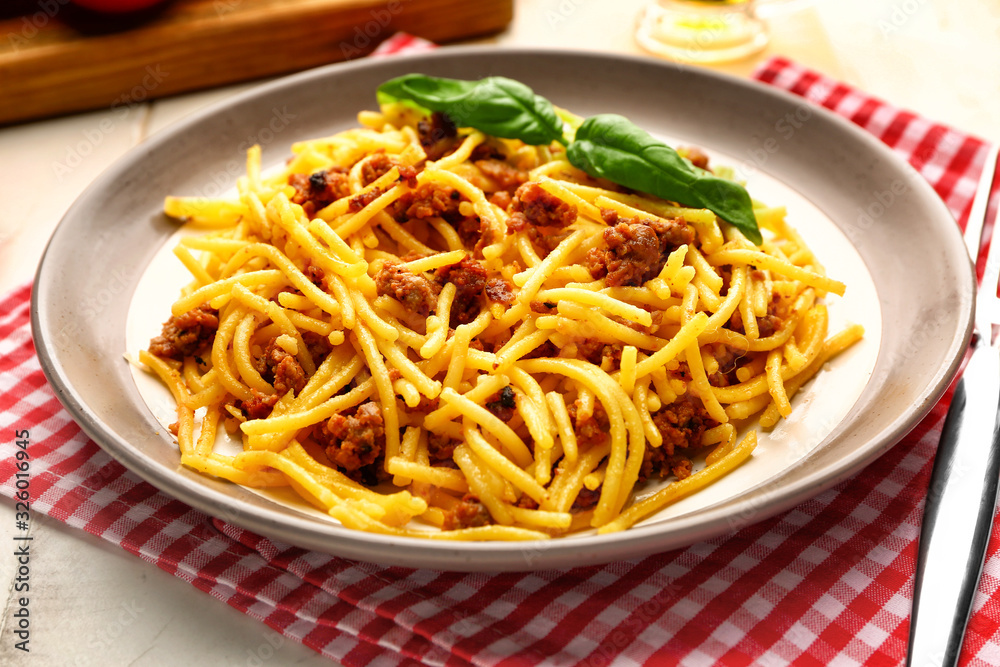 Plate with tasty pasta bolognese on table Plate with tasty pasta bolognese on table