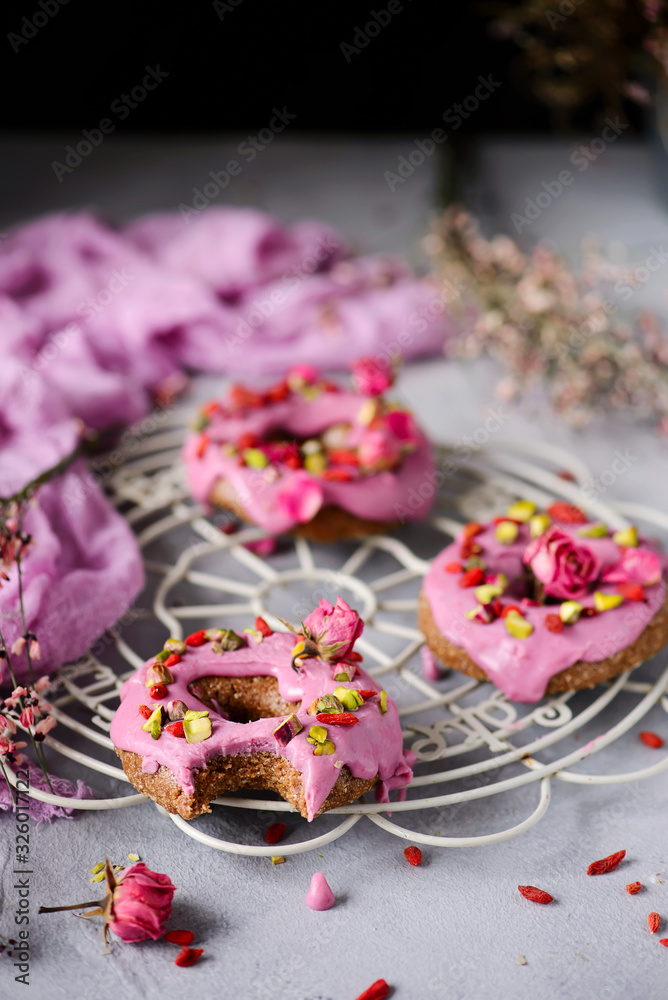 Vegan raw raspberry glaze donuts.selective focus. Vegan raw raspberry glaze donuts.selective focus.