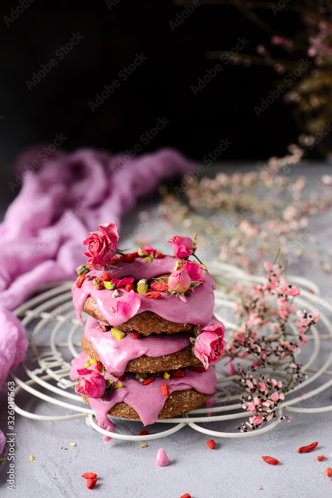 Vegan raw raspberry glaze donuts.selective focus. Vegan raw raspberry glaze donuts.selective focus.