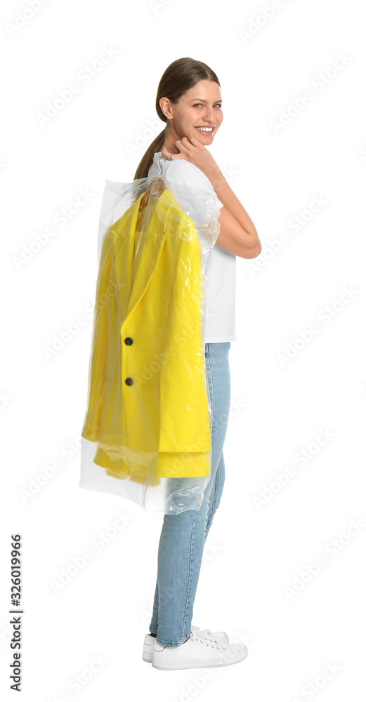Young woman holding hanger with jacket in plastic bag on white background. Dry-cleaning service Young woman holding hanger with jacket in plastic bag on white background. Dry-cleaning service