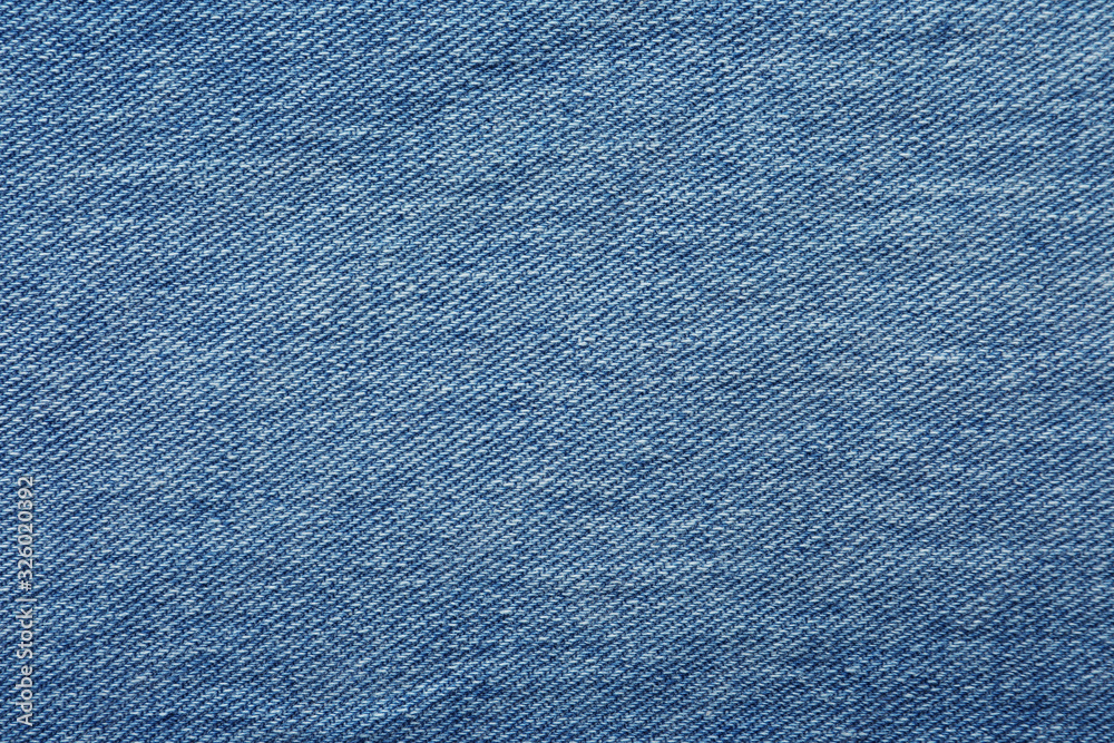 Texture of blue jeans as background, closeup