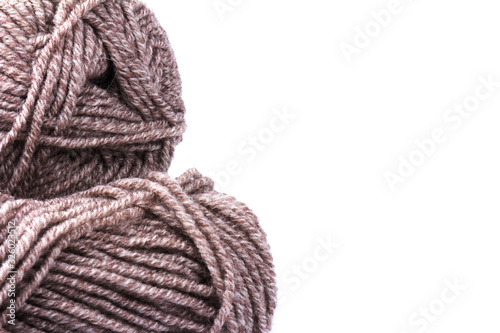 woolen threads on white background. natural wool knitting background