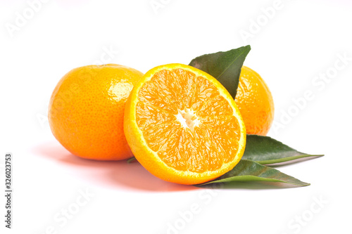 Fresh orange and leaves isolated on white background.