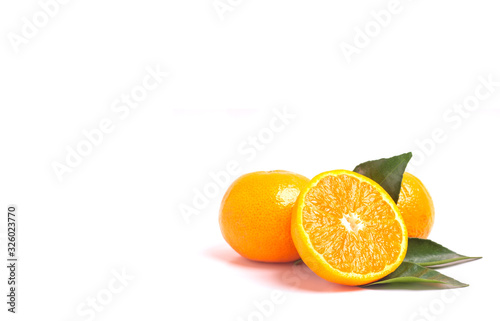 Fresh orange and leaves isolated on white background.