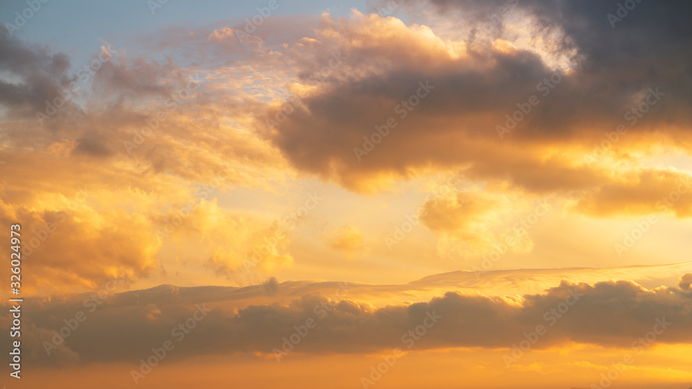 Beautiful bright sunset sky with clouds. Nature sky background. 