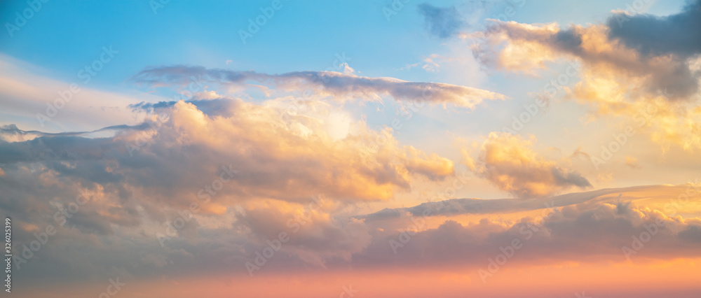 Beautiful bright sunset sky with clouds. Nature sky background. 