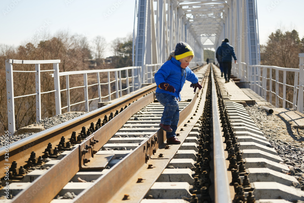 child is dangerous on the railroad tracks in spring child is dangerous on the railroad tracks in spring