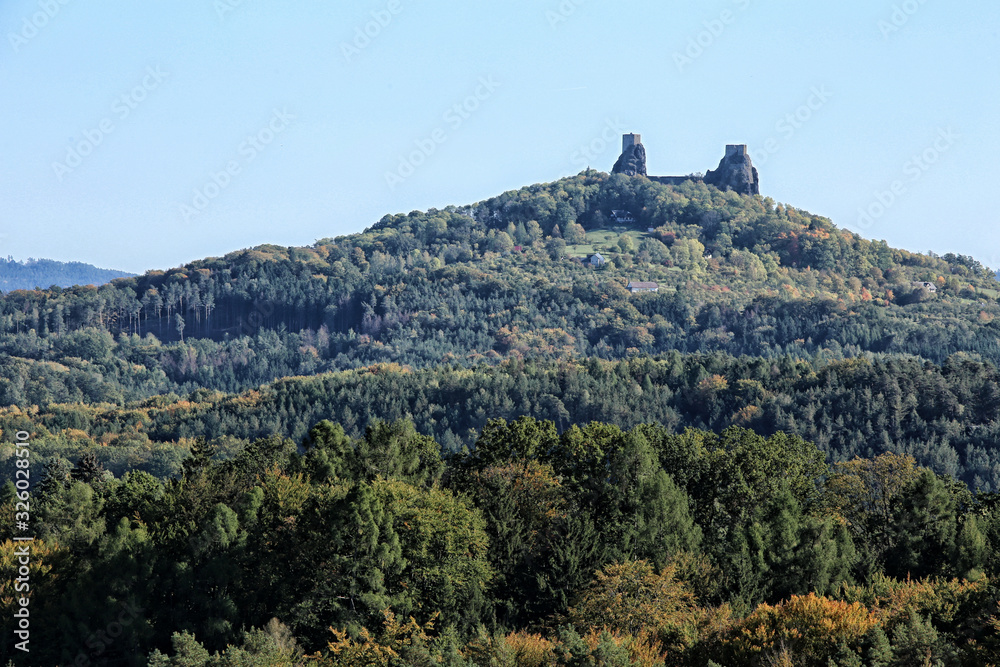 Distant towers to Trosky castle ruins on the top of hill Distant towers to Trosky castle ruins on the top of hill