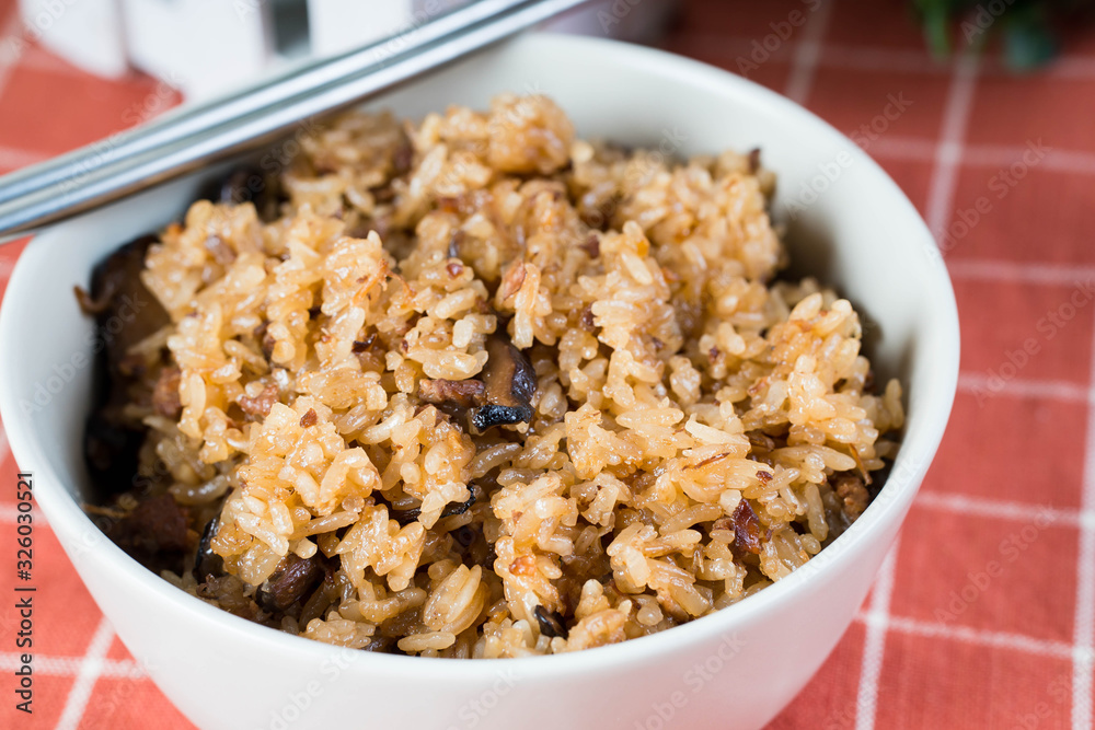 a sticky rice mixed with pork soy sauce and shiitake mushroom also known as kiam pong a sticky rice mixed with pork soy sauce and shiitake mushroom also known as kiam pong