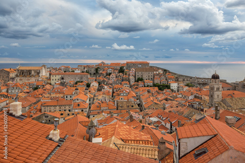 View of Dubrovnik old town buildings and red roofs from the city wall