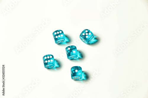 Isolated blue five pieces of transparent dice showing three six, five, two and one