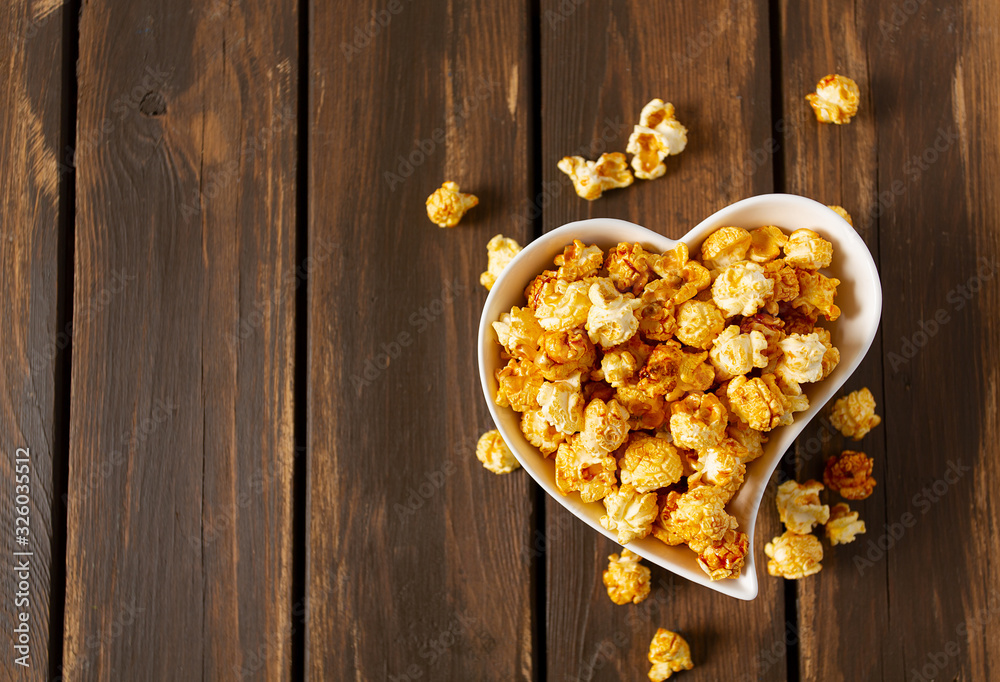 caramelized pop corn in a heart-shaped bowl caramelized pop corn in a heart-shaped bowl