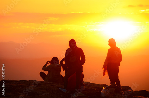 Peope and sunrise background with warm tone color and copy space.