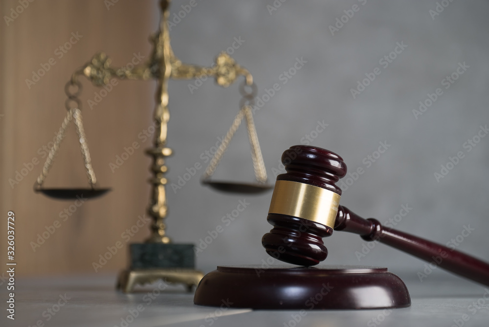 Law and Jusitce concept photo, grey stone background Law and Jusitce concept photo, grey stone background