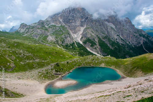 Amazing lake with azure water in Dolomite Alps photo