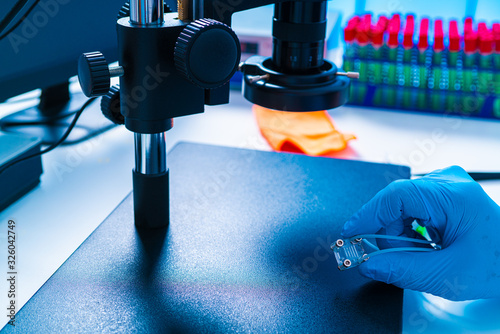 Organ-on-a-chip (OOC) - microfluidic device chip that simulates biological organs that is type of artificial organ. Prototype of design lab-on-a-chip in microfluidic laboratory photo