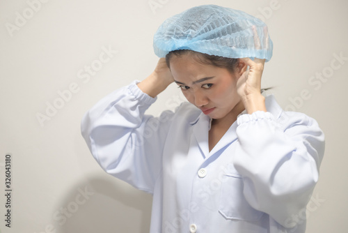 Medical personnel are wearing hats for cleanliness and to prevent contamination.
